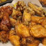 Medium serving of Wings in a mix of three sauces: Parmesan Garlic, Hot, and Honey BBQ.